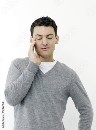 Photo: Sleepy man with eyes closed Sleepy man with eyes closed