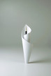 Paper wrapping around a painting brush