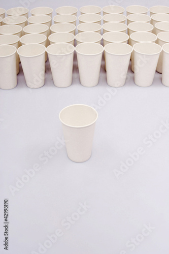 Photo: A group of paper cups with an isolated paper cup A group of paper cups with an isolated paper cup