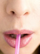 Drinking straw in mouth
