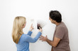 Couple choosing suitable colour from the colour chart