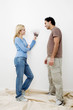 Couple choosing suitable colour from the colour chart
