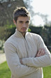 Man folding his arms while looking at the camera