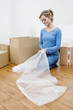 Woman cutting bubble pack