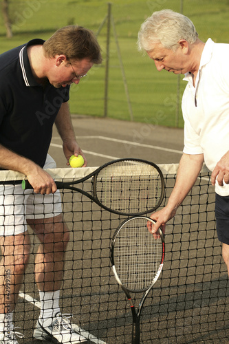 Photo: Men with tennis racquet and ball Men with tennis racquet and ball