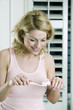 A woman about to clean her teeth