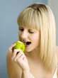 A woman going to eat an apple