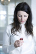 Woman holding cough syrup