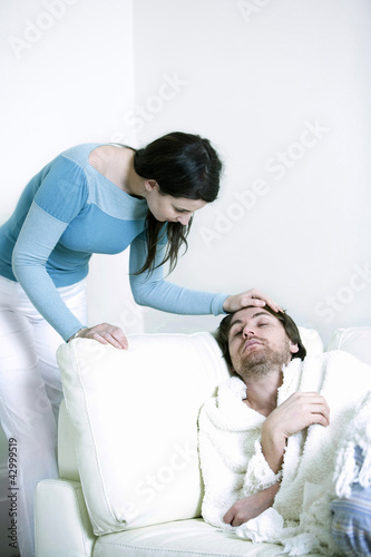 Photo: A woman caring for her ill boyfriend A woman caring for her ill boyfriend