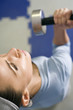 Woman lifting dumbbell