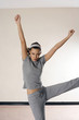 Woman raising her hands while dancing