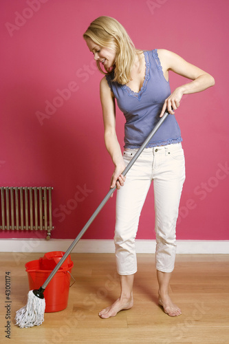 Photo: Woman mopping the floor Woman mopping the floor
