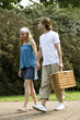 Photo: Man and woman walking in the park Man and woman walking in the park
