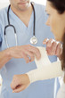 Male doctor treating a patient