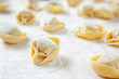 Making homemade tortellini