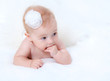 Portrait newborn baby lying in bed