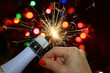 Happy new year  with woman hand opening champagne