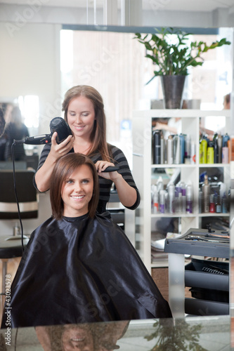 Photo: Stylist Drying Woman's Hair Stylist Drying Woman's Hair
