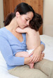Photo: Mum cuddling baby with chickenpox Mum cuddling baby with chickenpox