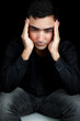 Hispanic man suffering a strong headache or depression