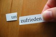 un-zufrieden