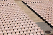 Many rosa chairs lined up for concert or speach
