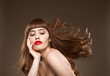 Foto: Sassy brunette with red lips Sassy brunette with red lips