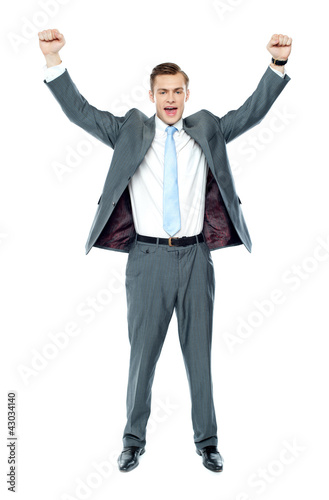 Photo: Full length portrait of a excited young executive Full length portrait of a excited young executive