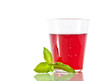 Berry compote with fresh mint leaf in glass isolated