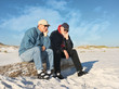 Foto: Two Bored Retired Men Sitting Together at the Beach Two Bored Retired Men Sitting Together at the Beach