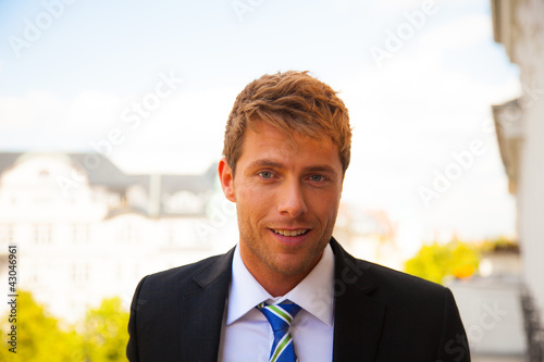 Photo: portrait of a business man outside portrait of a business man outside