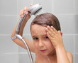 Little boy is bathed in the shower