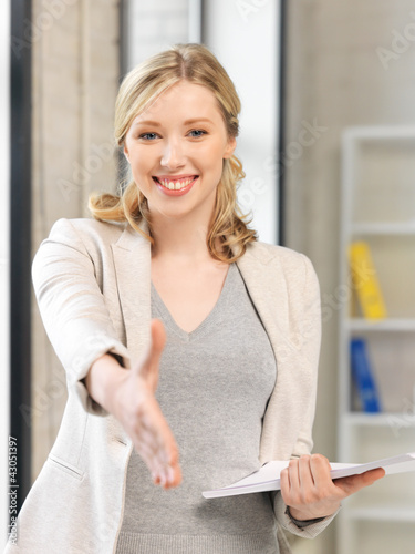 Photo: woman with an open hand ready for handshake woman with an open hand ready for handshake