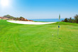 Golf green field on the background of the sea. In the summer in