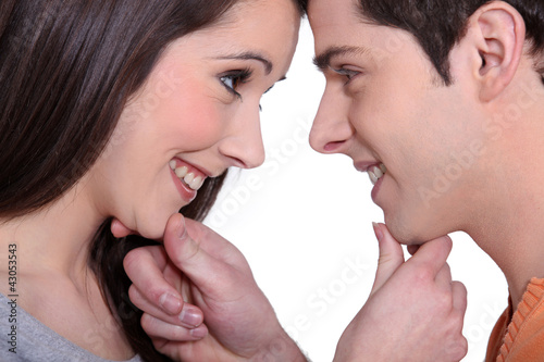 Photo: Young couple gazing lovingly into each other's eyes Young couple gazing lovingly into each other's eyes