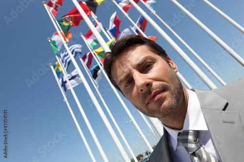 Photo: Businessman with flags. Businessman with flags.