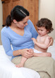Mum comforting crying baby