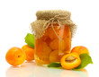 canned apricots in a jar and sweet apricots isolated on white
