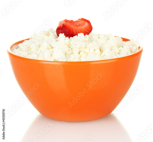 Photo: cottage cheese with strawberry in orange bowl isolated on white cottage cheese with strawberry in orange bowl isolated on white