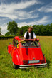 French man with his typical red car