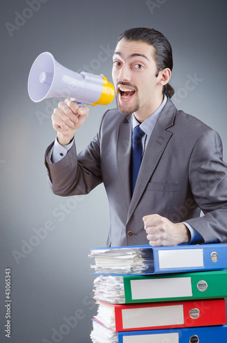Photo: Businessman shouting via loudspeaker Businessman shouting via loudspeaker