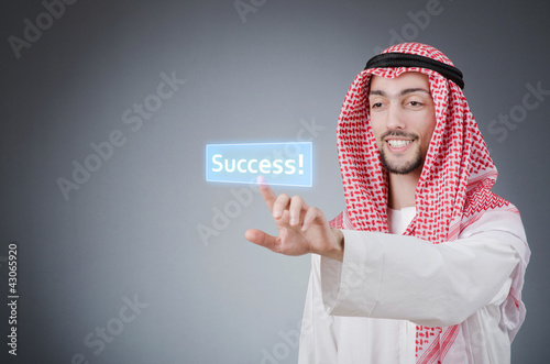 Illustration: Young arab pressing virtual buttons Young arab pressing virtual buttons