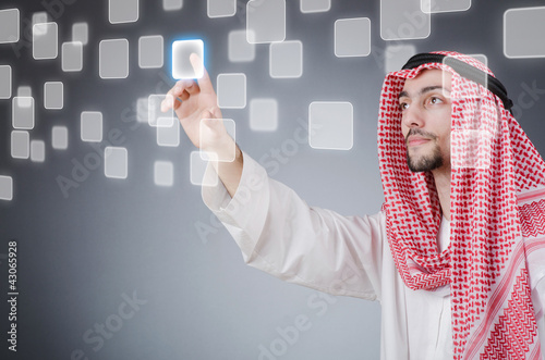 Illustration: Young arab pressing virtual buttons Young arab pressing virtual buttons