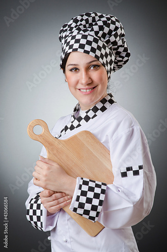 Foto: Woman cook isolated on the white Woman cook isolated on the white