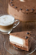 Triple chocolate cake on a wooden table