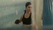 Young hispanic woman training and boxing in gym