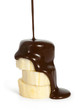 sliced ripe banana with poured chocolate