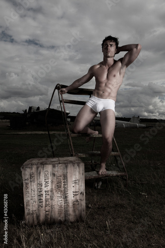 Photo: Muscular man posing in briefs Muscular man posing in briefs
