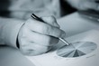 Hand and pen