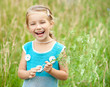 Cute little girl  on the meadow